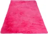 A fluffy pink rug is shown from a slightly elevated angle against a white background. Produktbild-Vorschau