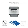 An image showing the contents of a printer package, including the printer itself, a power cord, and various manuals. Podgląd zdjęcia produktu