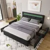 A bedroom scene featuring a bed with storage drawers and an LED headboard.