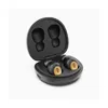 A pair of black wireless earbuds with wood accents are shown in their open charging case. Produktbild-Vorschau