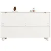 A white sideboard or cabinet with decorative items on top, shown from the back. Produktbild-Vorschau