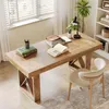 A home office setup with a wooden desk, chair, books, and a plant. Anteprima dell’immagine prodotto