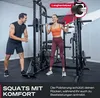 A man and a woman are in a gym, with the woman using a Smith machine. Produktbild-Vorschau