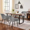 A dining room scene with a table and chairs set for a meal. Produktbild-Vorschau