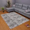 A living room scene with a sectional sofa, a rug, and a plant. Produktbild-Vorschau