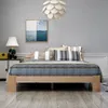 A bedroom scene with a bed, nightstand, and artwork. Náhled obrázku produktu