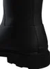 A close-up view of the heel and sole of a black boot. Produktbild-Vorschau