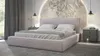 A bedroom scene featuring a pink upholstered bed with white bedding, bedside tables, and decorative wall art. Produktbild-Vorschau