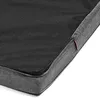 A close-up view of a dog mattress, showing the texture of the fabric and a zipper. Produktbild-Vorschau