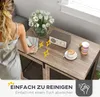 A woman is cleaning a wooden table with a cloth, with a bouquet of tulips, a radio, and a cup of coffee on it. There are also sparkling effects and text overlays. Produktbild-Vorschau