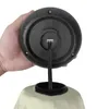 A hand holding the base of a beige umbrella, showing the connection point for the LED lights. Voir les images du produit