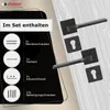 A set of black door handles and accessories is displayed against a light wood-grain background, with a black overlay showing product details and contents. Produktbild-Vorschau