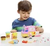 A young boy plays with a Play-Doh ice cream truck playset. Anteprima dell’immagine prodotto