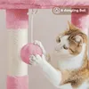 A cat playing with a pink ball attached to a cat tree. Podgląd zdjęcia produktu