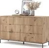 A wooden sideboard with black legs, decorated with books, a clock, and a vase with dried flowers. Voir les images du produit