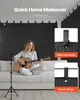 A woman plays guitar in front of sound-dampening blankets hung on a wall. Voir les images du produit