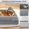 A dog sleeping on a dog bed, with callouts highlighting the materials and features of the bed. Voir les images du produit