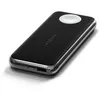 A black Satechi Quatro Wireless Power Bank with a silver trim and a white charging pad on a white background. Produktbild-Vorschau