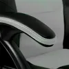 Close-up of the armrest of a black and white office chair. Produktbild-Vorschau