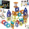 A collage of images showing a magnetic building block set with marble run components, including a box and assembled structures. Náhľad obrázku produktu
