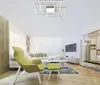 A modern living room with a sofa, chairs, coffee table, and TV. Anteprima dell’immagine prodotto
