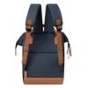 The back view of a blue backpack with brown accents. Produktbild-Vorschau