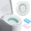 A toilet seat insert and two cleaning sponges are displayed against a white background. Produktbild-Vorschau