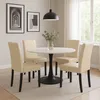 A dining set with a round table and four chairs in a well-lit room. Podgląd zdjęcia produktu