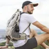 A man wearing a backpack sits outdoors, with a small black speaker clipped to his backpack. Voir les images du produit