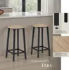 Two bar stools are placed in a modern kitchen setting, with a countertop and window in the background. Náhled obrázku produktu