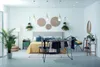 A bedroom scene with a drying rack in the foreground. Produktbild-Vorschau