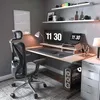 A modern home office setup with an ergonomic chair, desk, computer, and shelves. Náhled obrázku produktu