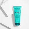 A product shot of a turquoise hair conditioner bottle against a white and light gray background. Náhled obrázku produktu