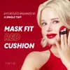 A woman is applying makeup with a cushion compact. Voir les images du produit