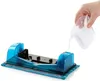 A hand is pouring liquid from a clear container into a blue cleaning device. Náhled obrázku produktu