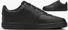 A pair of black Nike Court Vision Low Next Nat sneakers are shown from a side angle, with a second shoe visible in the background. Anteprima dell’immagine prodotto