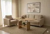 A living room scene with a couch, armchair, and a coffee table. Produktbild-Vorschau