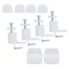 A set of white pleated blind mounting accessories, including top caps, clamp brackets with screws, and bottom pieces, arranged on a white background. Produktbild-Vorschau