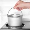 A hand holding an ice cream maker bowl over a base unit. Náhled obrázku produktu