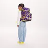 A young girl wearing a backpack. Anteprima dell’immagine prodotto