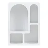 A white shelving unit with multiple compartments of varying shapes and sizes. Anteprima dell’immagine prodotto