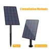 Two solar panels are shown, one plugged into the ground and the other wall-mounted, illustrating installation methods. Podgląd zdjęcia produktu