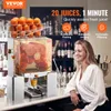 A commercial orange juicer is shown in a bar setting with a woman smiling in the foreground. Produktbild-Vorschau