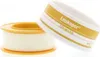 Two rolls of medical tape are shown against a white background. One roll is in focus in the foreground, and the other is slightly out of focus in the background. Anteprima dell’immagine prodotto