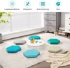 A collection of hexagonal floor cushions arranged on a rug in a child's room, with a white circular table in the center. Produktbild-Vorschau