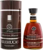 A bottle of Arehucas Ron Reserva Special and its cylindrical packaging are shown against a white background. Produktbild-Vorschau