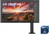 A computer monitor on a stand, displaying a landscape image. A small blue card is visible to the right. Produktbild-Vorschau