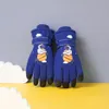 A pair of blue children's winter gloves with an astronaut and planet design, set against a gray and yellow background with white cloud-like shapes. Produktbild-Vorschau