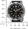 A watch is shown with a ruler for scale and measurement markings. Produktbild-Vorschau