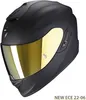 A black Scorpion Exo helmet with a gold visor is shown against a white background. Podgląd zdjęcia produktu